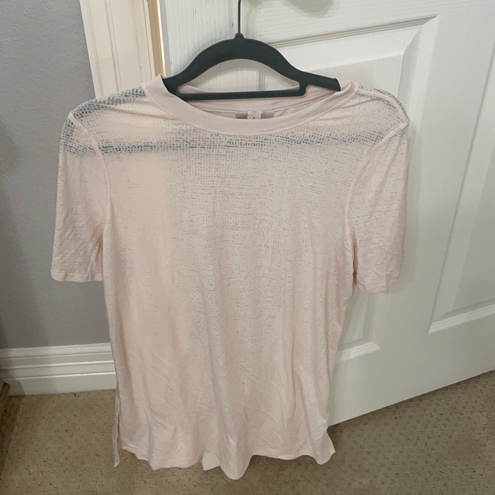 Peach/pink tissue shirt from lululemon. Size 6.